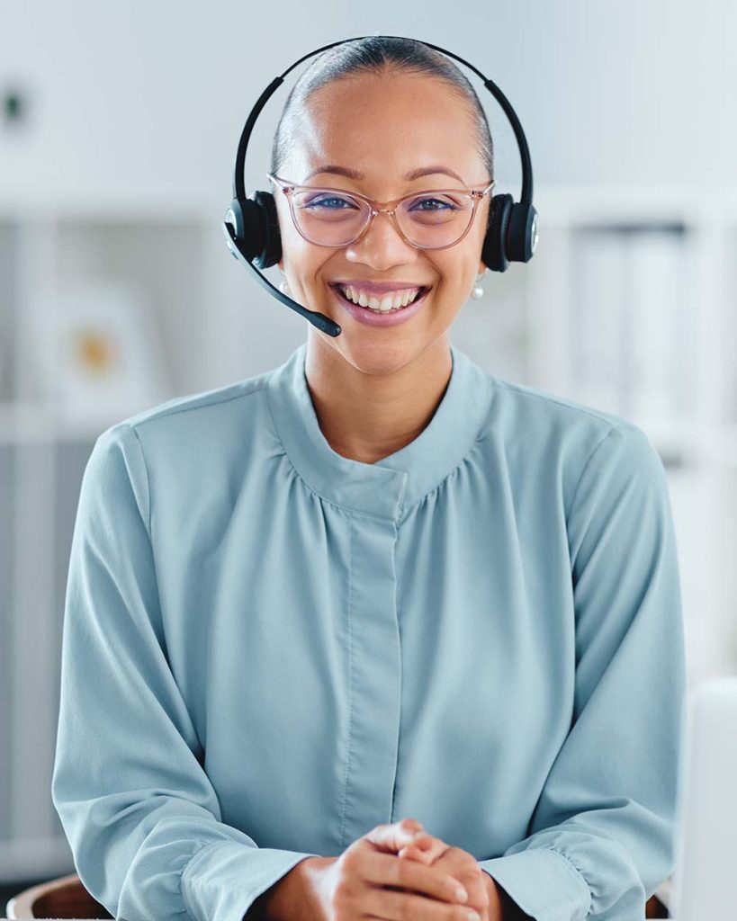 Happy and confident call center agent sitting in f 5PLARAU.jpg